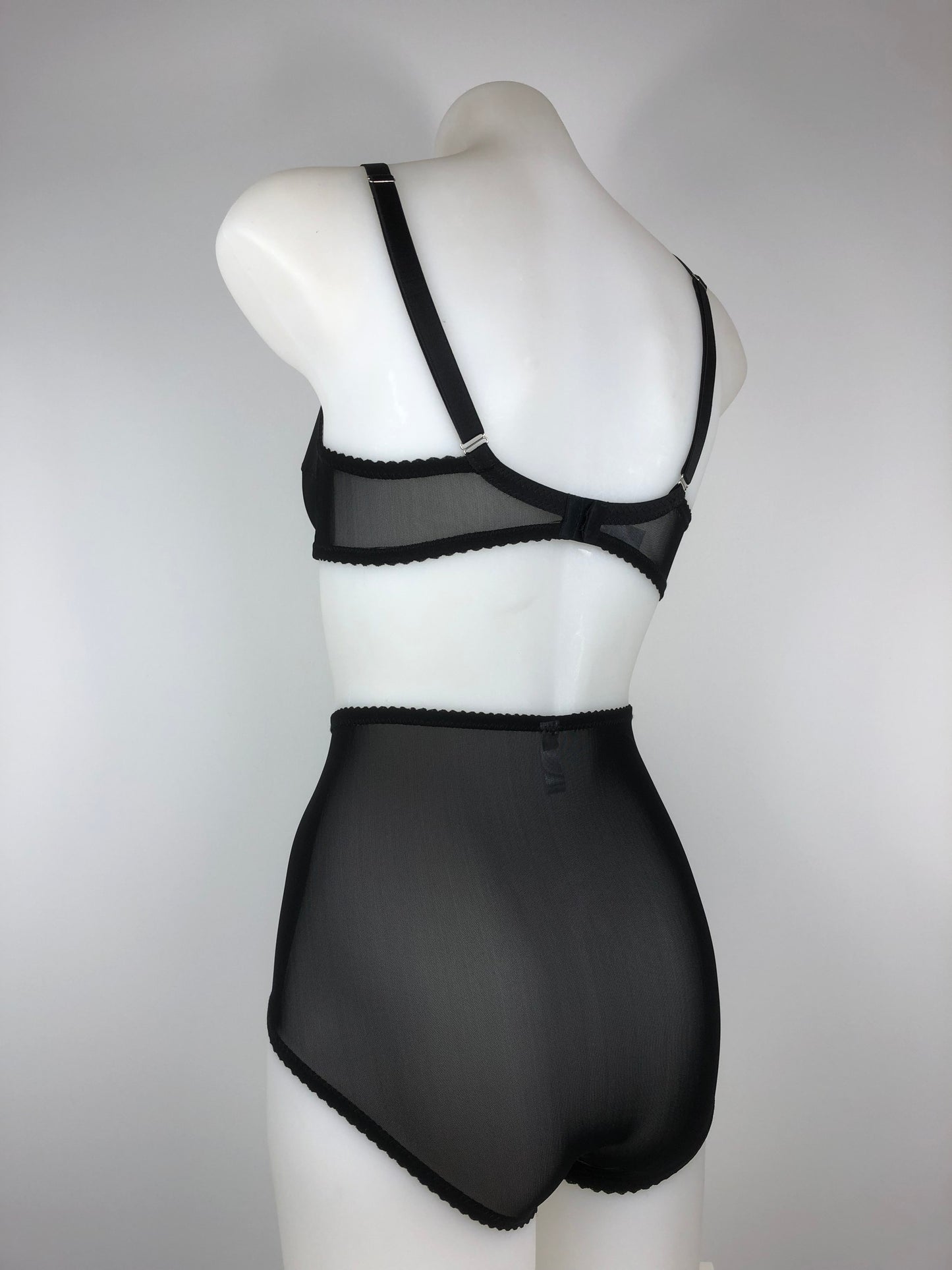Sheer see through black mesh pantie girdle. High waisted knicker brief. Transparent fetish bettie page pin up inspired lingerie underwear. Girdlette, soft bra and underwired corselette also available