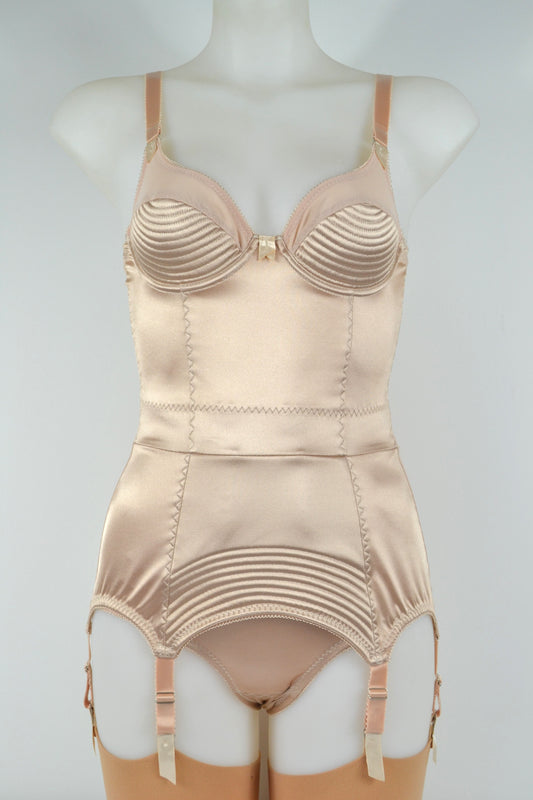 Biscotti corselette with vintage bullet bra inspired spiral stitching. Worn by a burlesque dancer, ideal showgirl lingerie costume. Bespoke lingerie made to measure in the UK