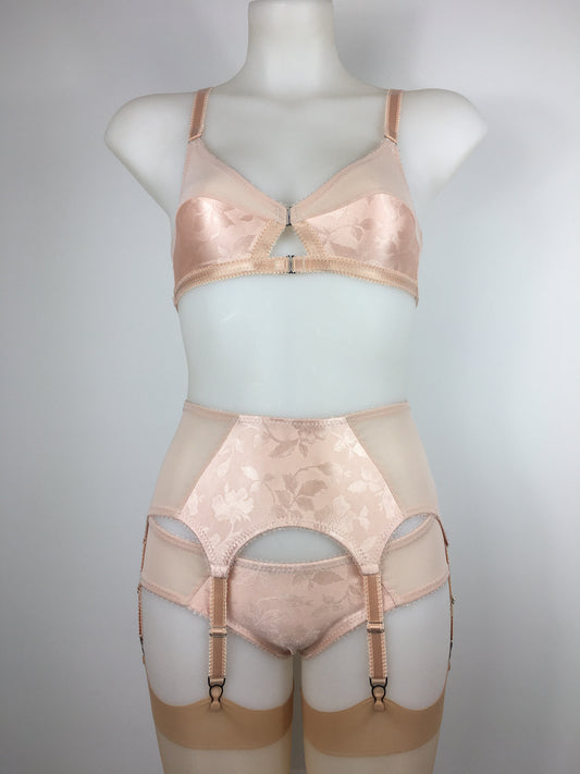 Our most authentic looking vintage inspired lingerie yet. Perfect peachy satin six strap suspender belt with a vintage peachy front panel and nude biscotti mesh sides. 6 adjustable suspender straps with a garter grip on each, perfect for holding your seamed stockings in place all day and for pairing with true vintage lingerie from 1920s, 1930s, 1940s and 1950s. Faux vintage lingerie