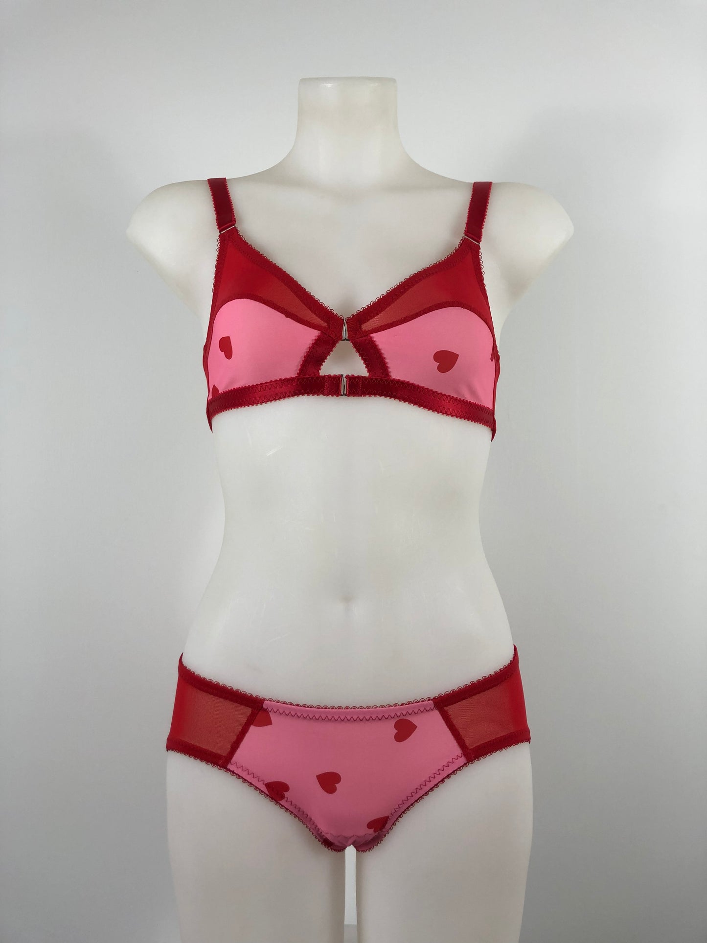 red and pink heart lingerie. vintage inspired soft bralette with pink heart front and red mesh sides, perfect for valentines cheesecake pin ups, front fastening soft vintage style bullet bra A fun, bold, playful retro inspired underwear set