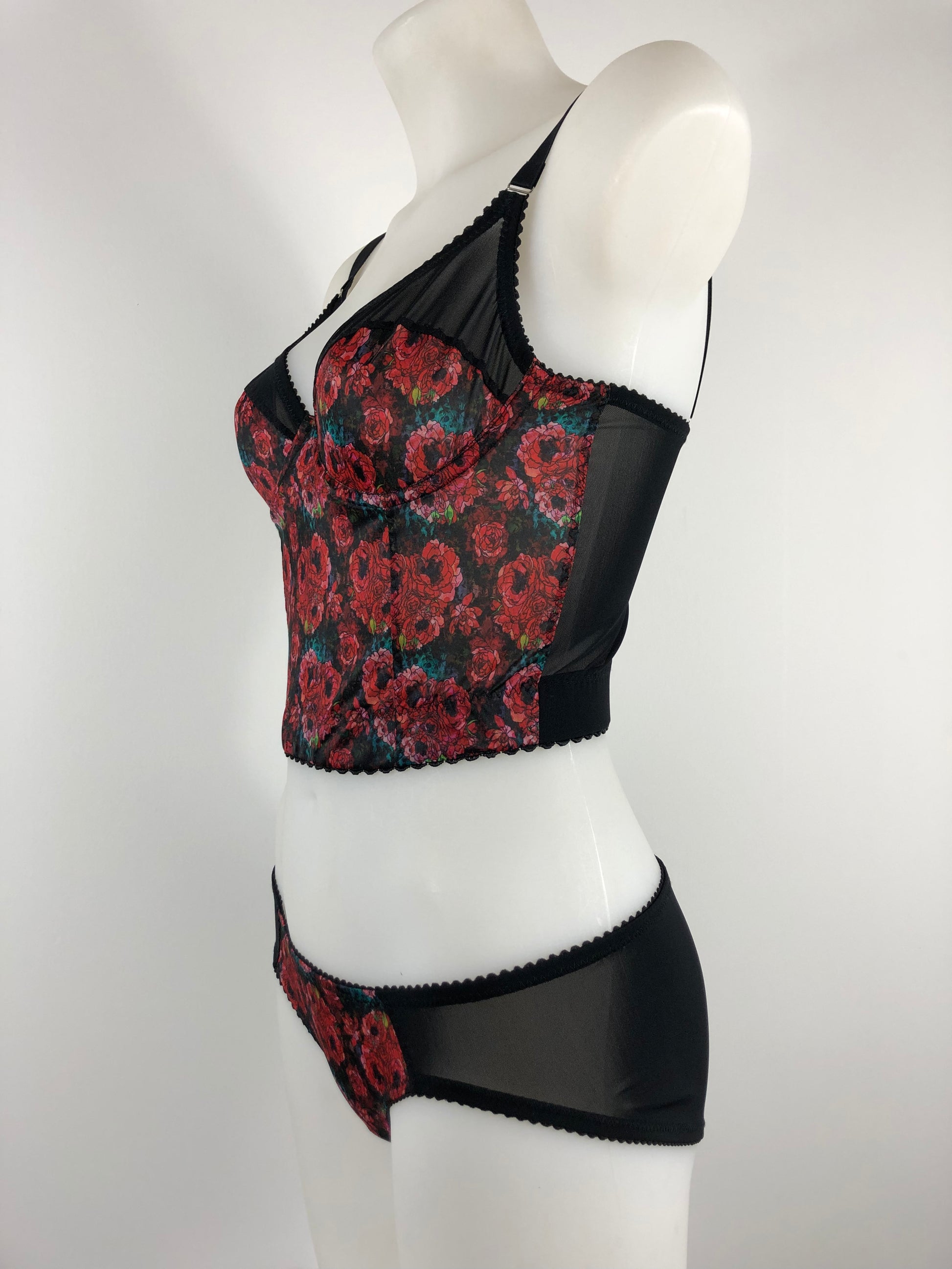 love witch inspired lingerie set. extra longline underwired bra inspired by the anna biller film. Used a rich red floral brocade style pattern with black mesh and trims. Ideal gothic, spiritual, witchy underwear