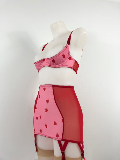 red and pink heart lingerie. vintage inspired longline girdle with pink heart front and red mesh sides, perfect for valentines cheesecake pin ups, six suspender garter clips to hold up seamed stockings. A fun, bold, playful retro inspired underwear set