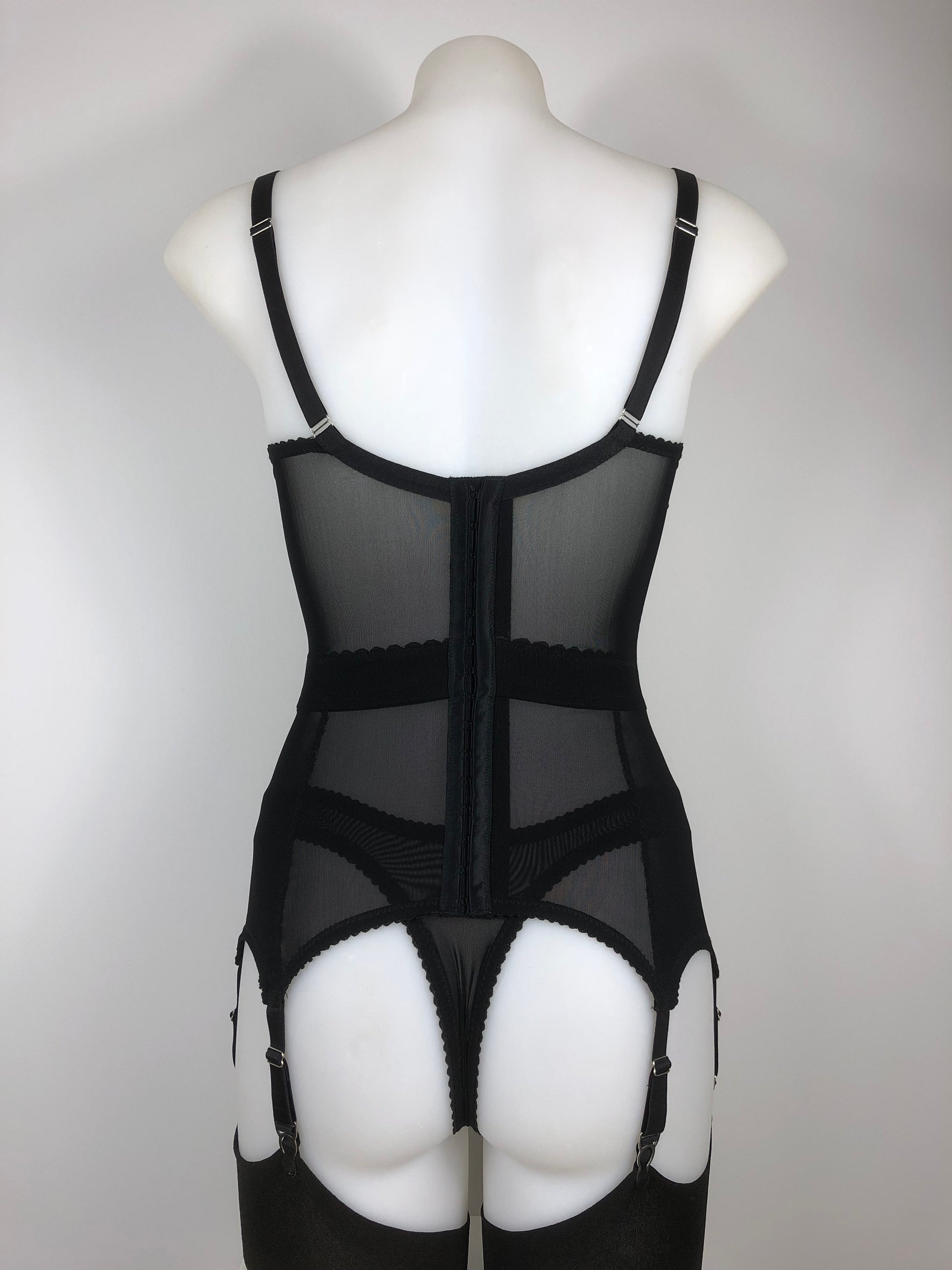 Sheer see through black mesh thong. Transparent fetish bettie page pin up inspired lingerie underwear. Girdlette, soft bra and underwired corselette also available