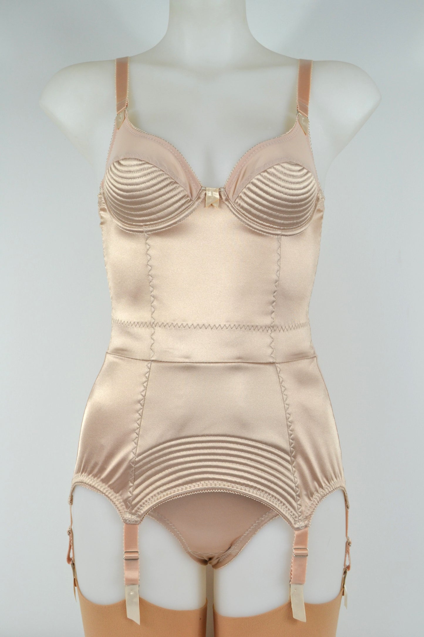 Biscotti corselette with vintage bullet bra inspired spiral stitching. Worn by a burlesque dancer, ideal showgirl lingerie costume. Bespoke lingerie made to measure in the UK 