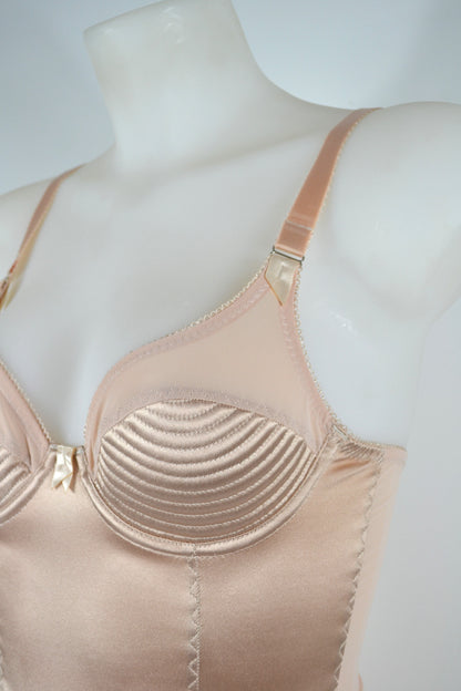 Biscotti corselette with vintage bullet bra inspired spiral stitching. Worn by a burlesque dancer, ideal showgirl lingerie costume. Bespoke lingerie made to measure in the UK 