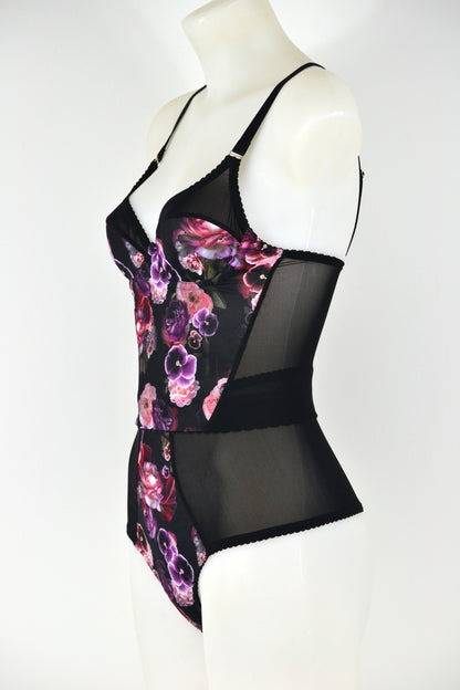 Black floral longline bra on a mannequin against a white background. vintage 1950s inspired underwear