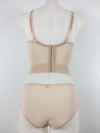 Our most authentic looking vintage inspired lingerie yet. Perfect peachy satin longline 1950s underwired bra. Peachy vintage front panels and nude biscotti mesh back. More subtle silhouette then a bullet bra, longline length makes this faux vintage bra perfect for wearing under true vintage dresses and fashion. Faux vintage reproduction lingerie made in the uk in a 1940s and 1950s underwear style