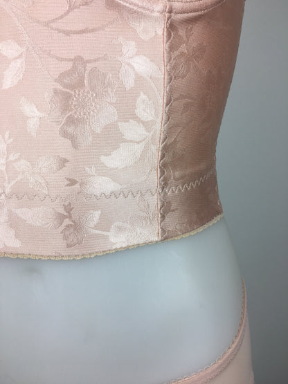 Our most authentic looking vintage inspired lingerie yet. Perfect peachy satin longline 1950s underwired bra. Peachy vintage front panels and nude biscotti mesh back. More subtle silhouette then a bullet bra, longline length makes this faux vintage bra perfect for wearing under true vintage dresses and fashion. Faux vintage reproduction lingerie made in the uk in a 1940s and 1950s underwear style