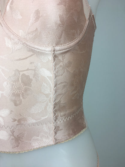 Our most authentic looking vintage inspired lingerie yet. Perfect peachy satin longline 1950s underwired bra. Peachy vintage front panels and nude biscotti mesh back. More subtle silhouette then a bullet bra, longline length makes this faux vintage bra perfect for wearing under true vintage dresses and fashion. Faux vintage reproduction lingerie made in the uk in a 1940s and 1950s underwear style