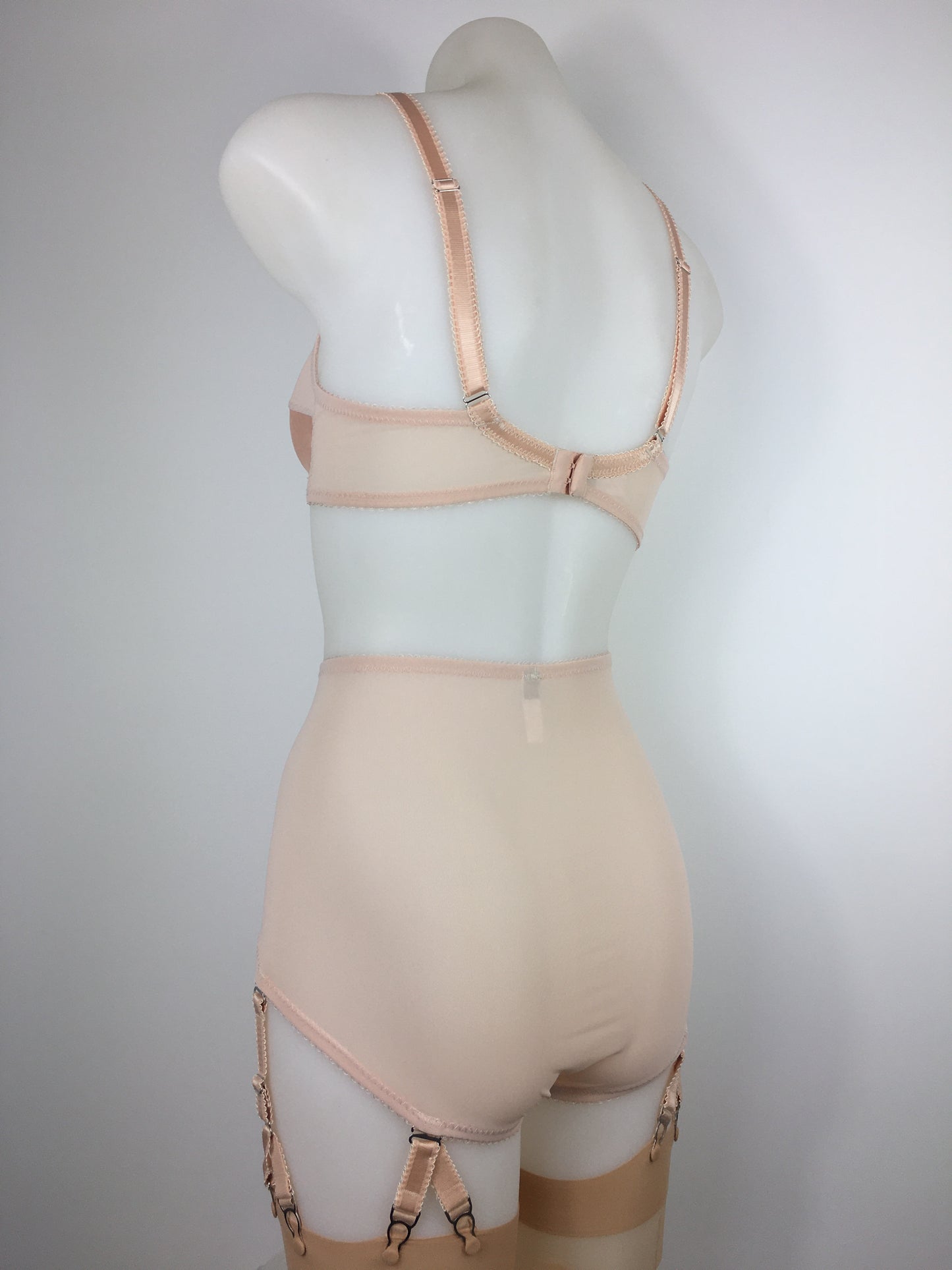 Our most authentic looking vintage inspired lingerie yet. Perfect peachy satin pantie girdle or high waisted knicker with 6 detachable Y straps, characteristic of pip and pantalaimon. Nude big shapewear knickers with garter straps to keep your seamed stockings in place all day. Fabulous faux and reproduction lingerie made in the uk
