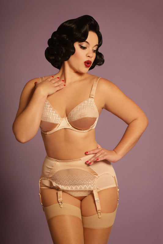 1920s inspired lingerie with art deco style sheer tulle embroidery. 1930s vintage style underwear, perfect for great Gatsby themes events. Art deco underwired bra with sheer retro art deco lace, six strap suspender belt and classic cut pantie knicker. Steel garter clips. Burlesque sheer nude skin peach biscotti lingerie and underwear made in the UK.