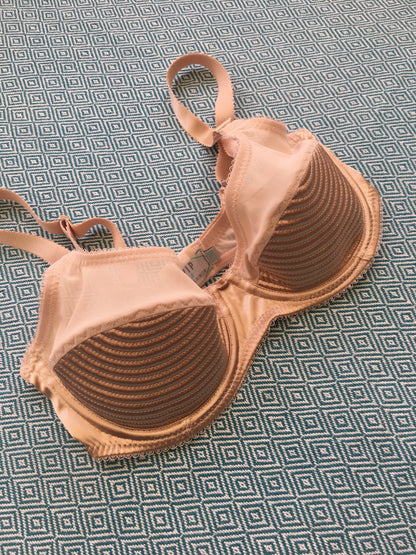 1950s bullet bra inspired underwire bra in vintage peach biscotti satin. Padded spiral stitching circle stitch in 1940's lingerie style with matching six strap suspender belt and high waisted knickers panties