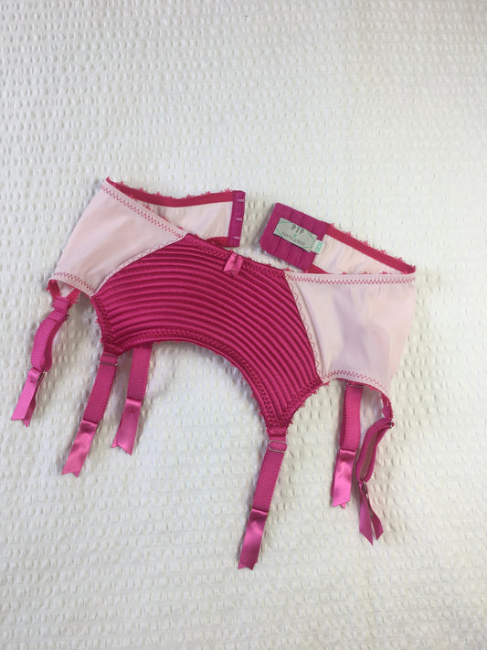hot pink padded underwired bra with pale pink mesh and vintage style spiral stitching on the lower cup.  Inspired by vintage 1950s bullet bras but with a softer modern shape. Matching 6 strap suspender belt with metal garter clips and high waisted pantie girdle knicker also available.  Barbie vibe lingerie and underwear to be worn with seamed stockings