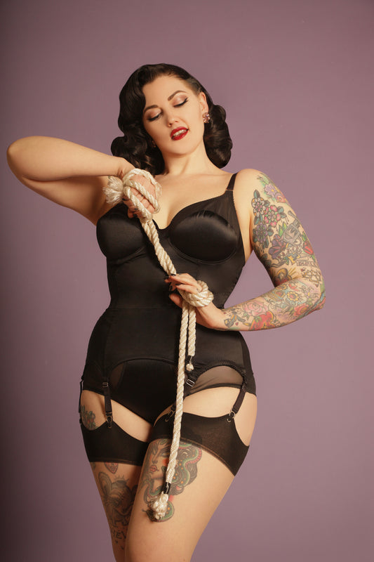 black satin underwired corselette. Six steel suspender straps and elastic waistband. shape wear lingerie made to order in the uk. vintage retro inspired lingerie and underwear by Pip & Pantalaimon 1950s fetish bettie page lingerie corset