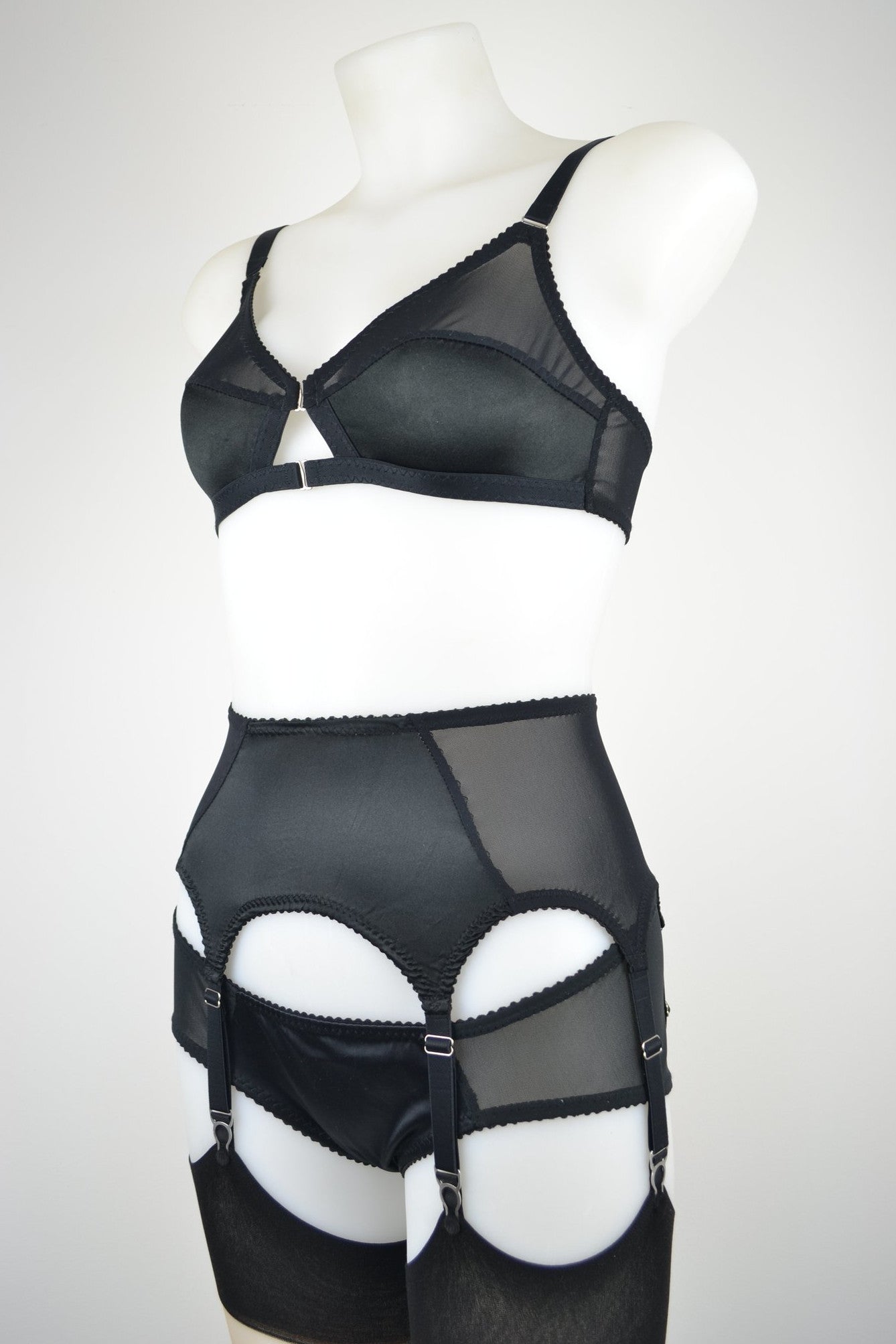 luxury black silk suspender belt lingerie with 6 metal clips. Available in plus size and ethically and sustainably made in the uk by retro and vintage lingerie brand pip and pantalaimon. Transgender non-binary underwear and lingerie