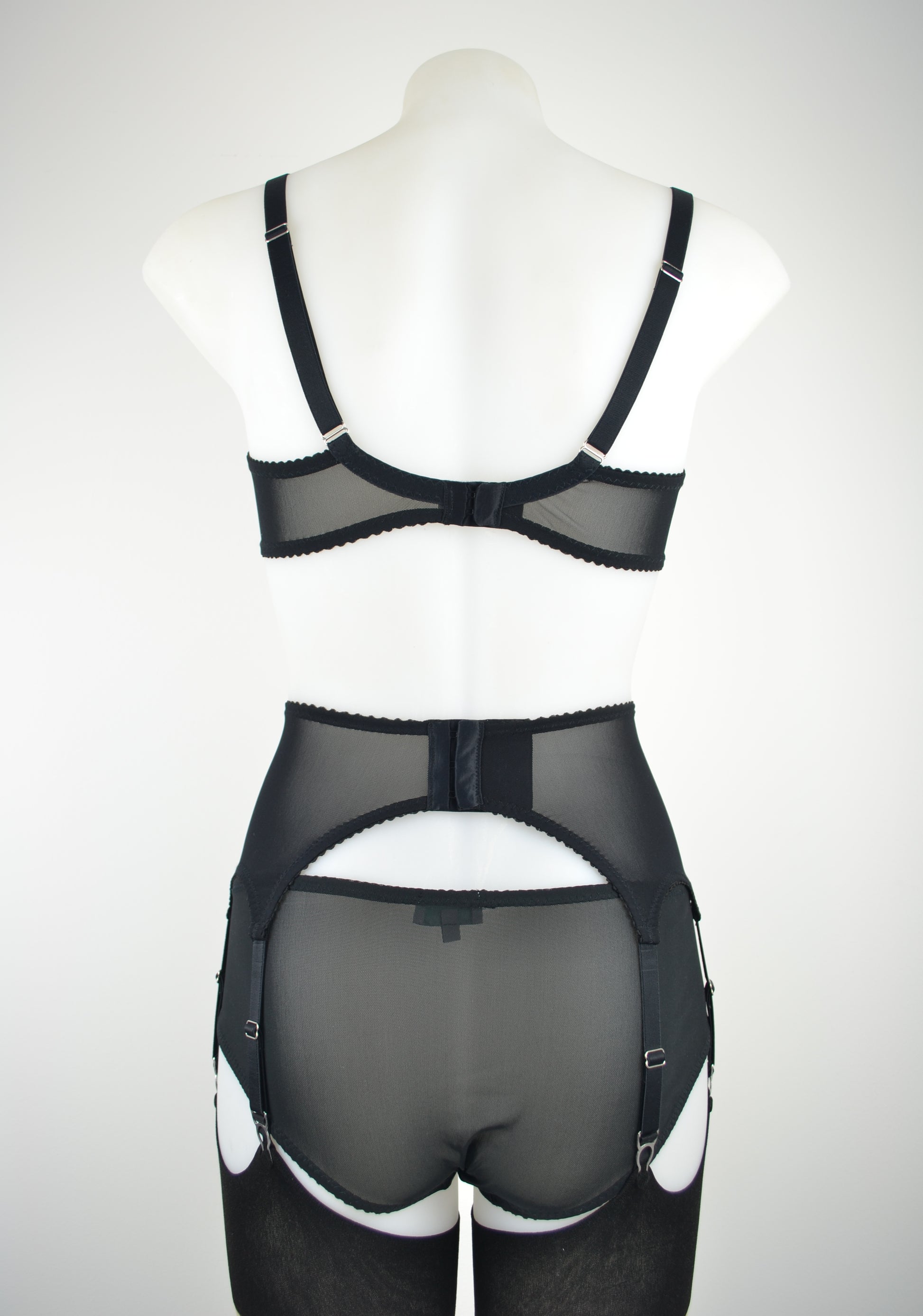 luxury black silk suspender belt lingerie with 6 metal clips. Available in plus size and ethically and sustainably made in the uk by retro and vintage lingerie brand pip and pantalaimon. Transgender non-binary underwear and lingerie