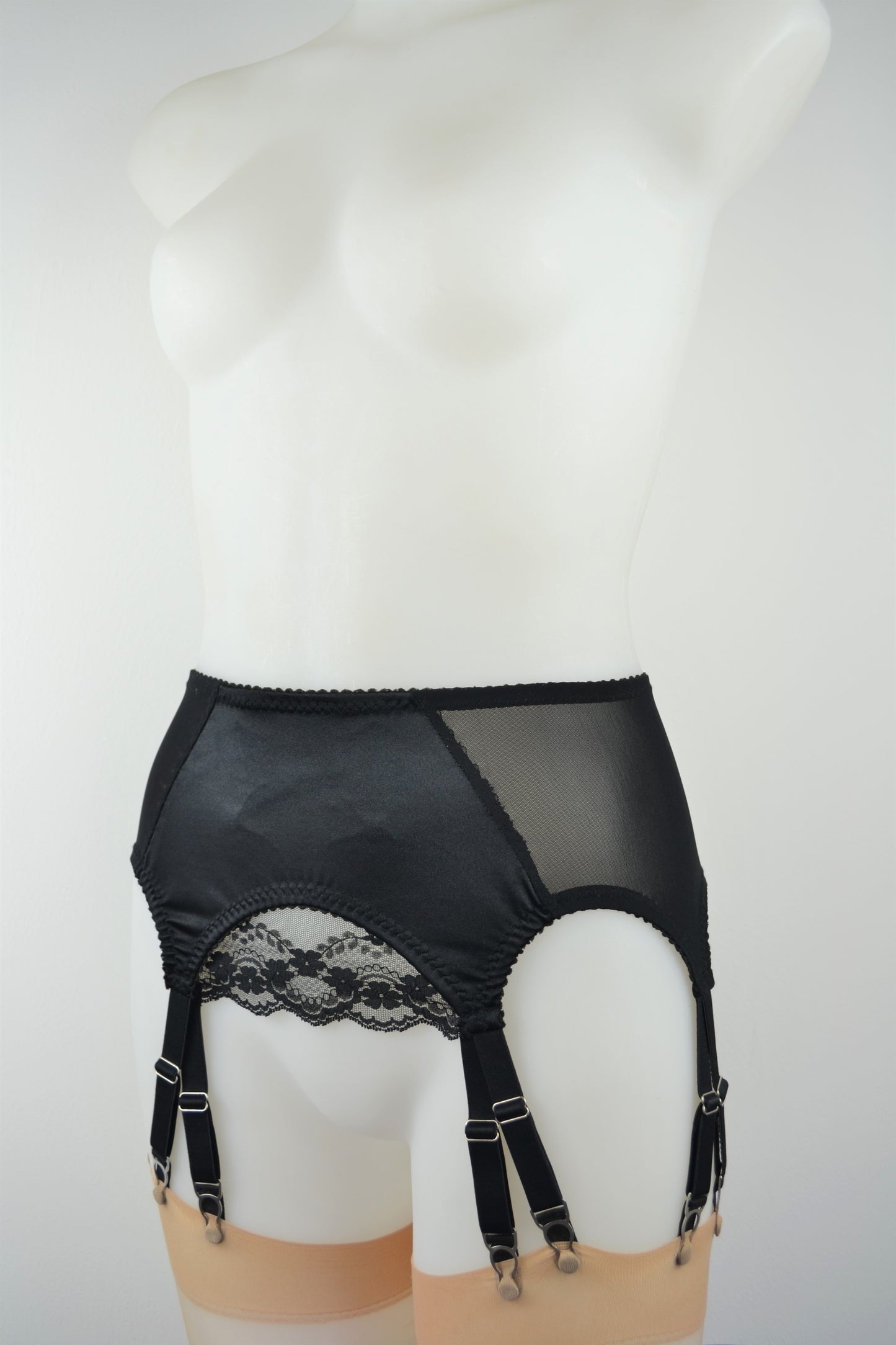 12 strap suspender garter belt with metal clips. layered black satin and lace garter suspender belt by pip and pantalaimon, ethically and sustainably made in the UK. in plus size retro and vintage lingerie.