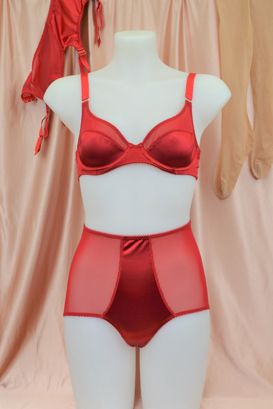 red satin shapewear lingerie. Vintage inspired valentines underwear. Red shapewear satin and red power net underwired bra, six strap suspender belt with steel garter clips and classic cut knicker or high waisted pantie girdle. Custom made red lingerie made to order in the UK. Red satin underwear with no lace. Perfect for Christmas and Valentines