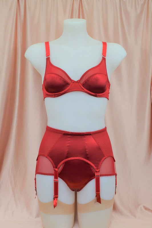 red satin shapewear lingerie. Vintage inspired valentines underwear. Red shapewear satin and red power net underwired bra, six strap suspender belt with steel garter clips and classic cut knicker or high waisted pantie girdle. Custom made red lingerie made to order in the UK. Red satin underwear with no lace. Perfect for Christmas and Valentines