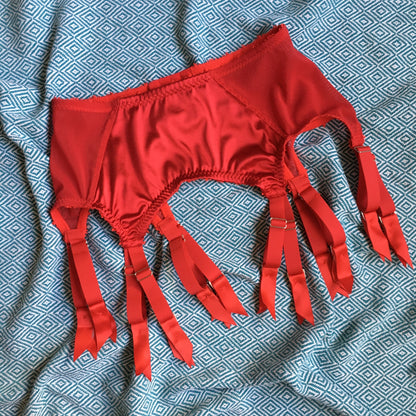 red satin shapewear lingerie. Vintage inspired valentines underwear. Red shapewear satin and red power net underwired bra, six strap suspender belt with steel garter clips and classic cut knicker or high waisted pantie girdle. Custom made red lingerie made to order in the UK. Red satin underwear with no lace. Perfect for Christmas and Valentines