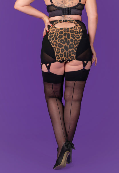 seamed nylon stockings in a vintage style. Sheer black 15 denier stockings with a black welt and black seam down the back. To be worn with suspender and garter belts