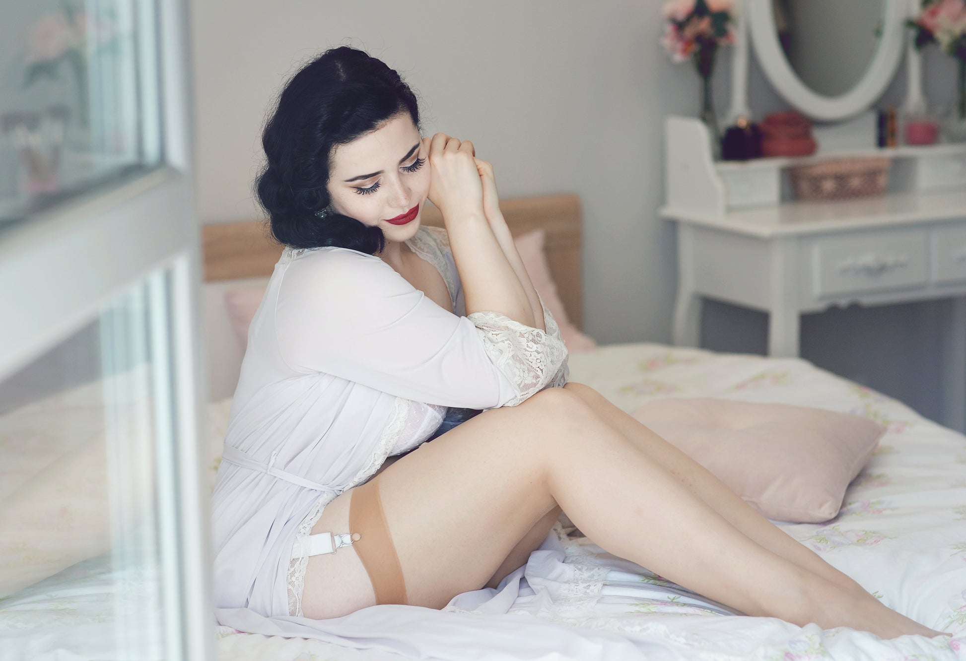 seamed nylon stockings in a vintage style. Biscotti nude stockings with a pale nude welt and pale nude seam down the back. To be worn with suspender and garter belts