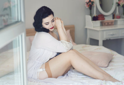 seamed nylon stockings in a vintage style. Biscotti nude stockings with a pale nude welt and pale nude seam down the back. To be worn with suspender and garter belts