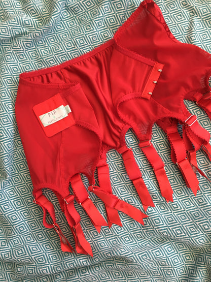 red satin shapewear lingerie. Vintage inspired valentines underwear. Red shapewear satin and red power net underwired bra, six strap suspender belt with steel garter clips and classic cut knicker or high waisted pantie girdle. Custom made red lingerie made to order in the UK. Red satin underwear with no lace. Perfect for Christmas and Valentines