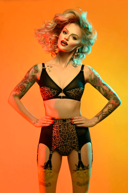 vintage inspired lingerie garter belt six stray suspender belt with Y straps in leopard print. Vintage inspired fetish bettie page bullet bra lingerie by pip and pantalaimon. Retro underwear made in the UK in animal print. Soft bra, front fastening bralette and classic cut panties knickers. 3 piece lingerie set paired perfectly with seamed stockings