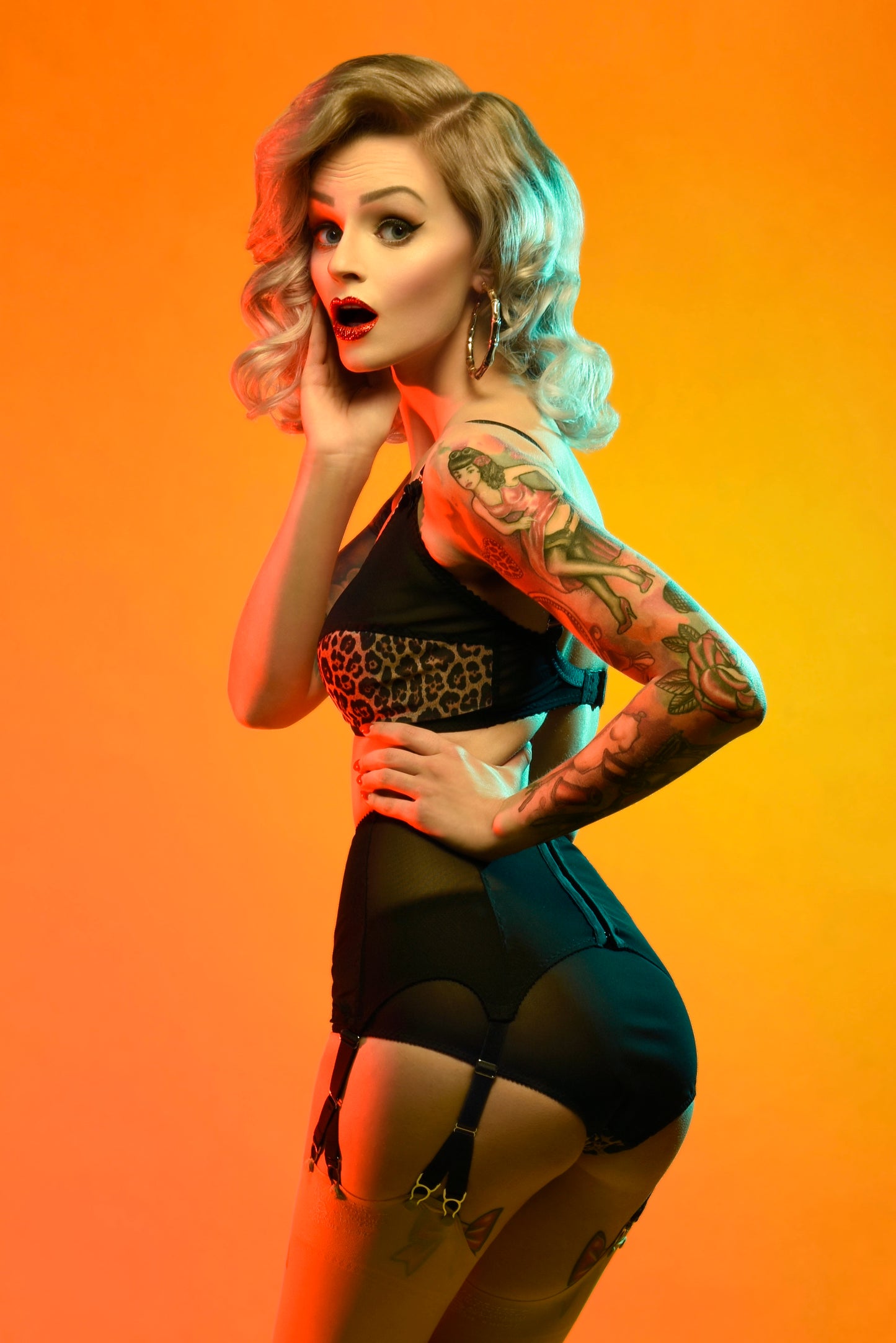 vintage inspired lingerie garter belt six stray suspender belt with Y straps in leopard print. Vintage inspired fetish bettie page bullet bra lingerie by pip and pantalaimon. Retro underwear made in the UK in animal print. Soft bra, front fastening bralette and classic cut panties knickers. 3 piece lingerie set paired perfectly with seamed stockings